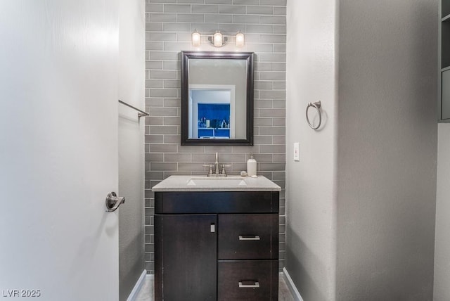 bathroom with vanity and baseboards