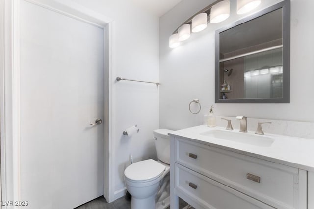 full bath with vanity, toilet, and walk in shower