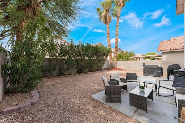 view of yard featuring a patio, a fenced backyard, and an outdoor hangout area