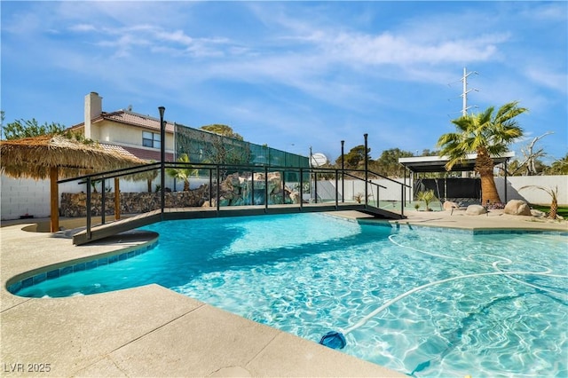 view of pool featuring a patio, fence, and a fenced in pool