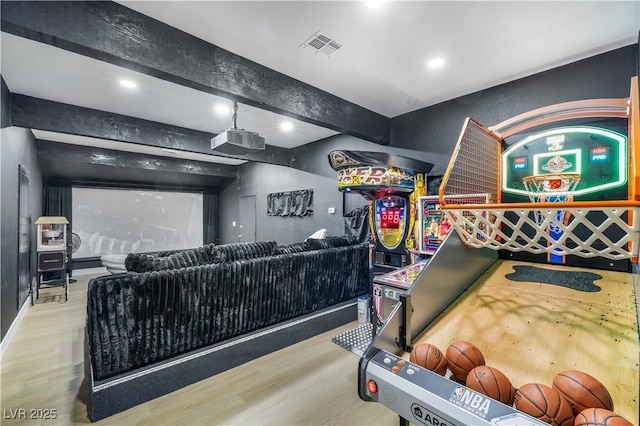 playroom with beam ceiling, visible vents, recessed lighting, and wood finished floors