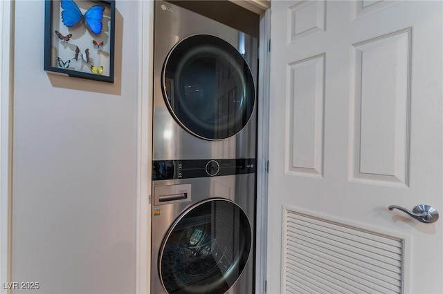 washroom with laundry area and stacked washer / dryer