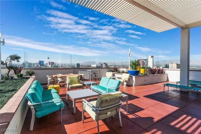 view of patio featuring a view of city, an outdoor hangout area, and a pergola