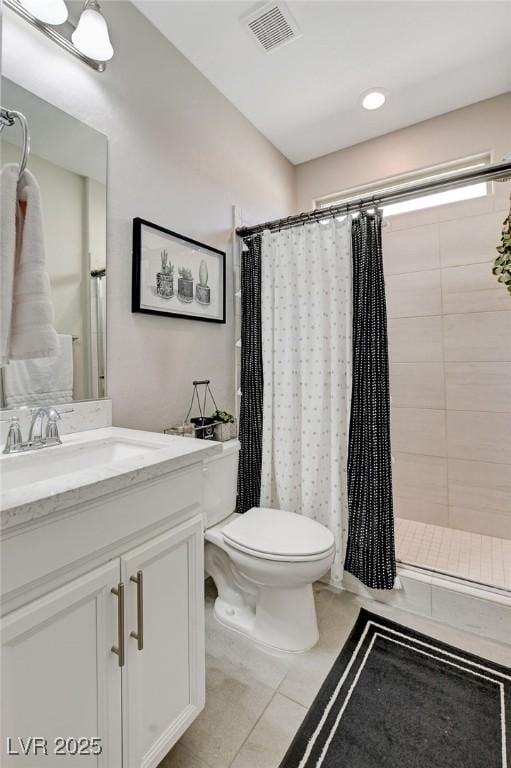 full bathroom with vanity, visible vents, tiled shower, tile patterned flooring, and toilet