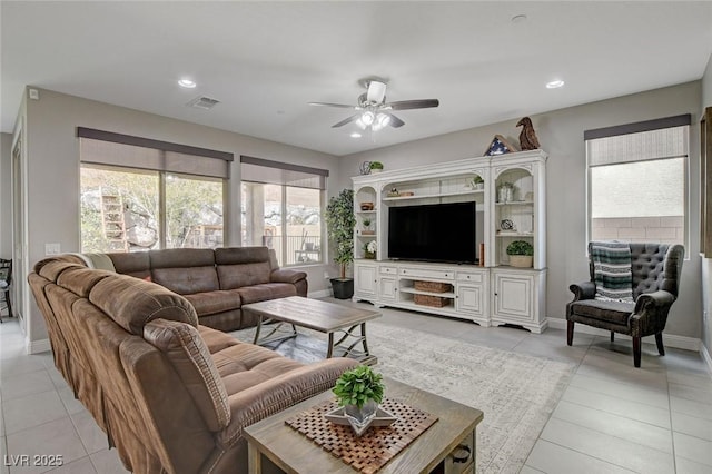 living area with a ceiling fan, recessed lighting, visible vents, and baseboards