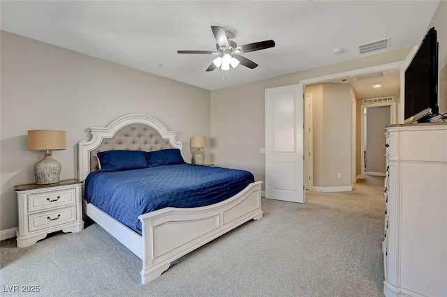 bedroom with visible vents, light colored carpet, a ceiling fan, and baseboards