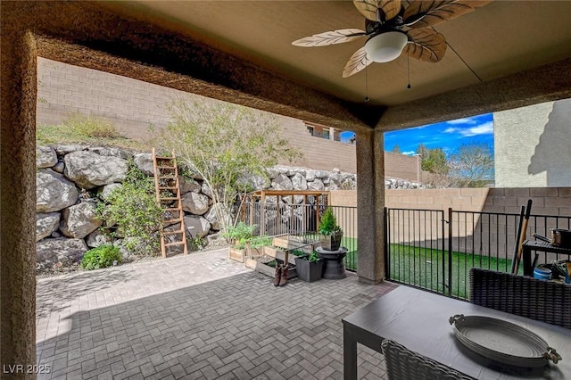 view of patio / terrace featuring a fenced backyard and ceiling fan