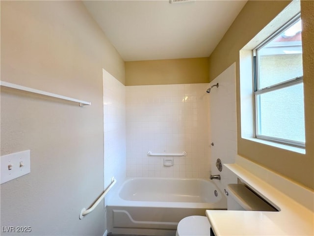 full bathroom with bathtub / shower combination and toilet