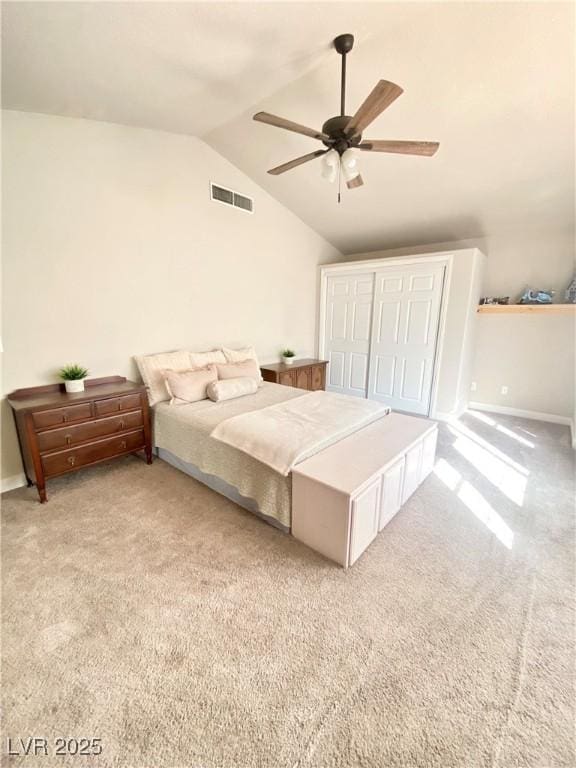 carpeted bedroom featuring visible vents, ceiling fan, and vaulted ceiling