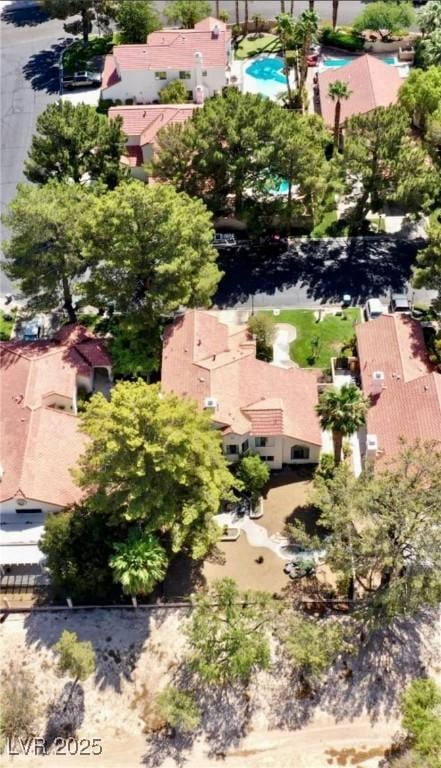 birds eye view of property with a residential view