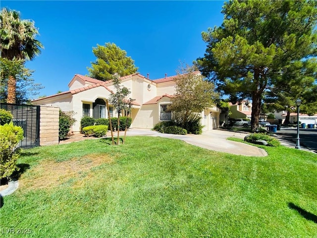 view of front of property with driveway, stucco siding, a front lawn, a garage, and a tile roof