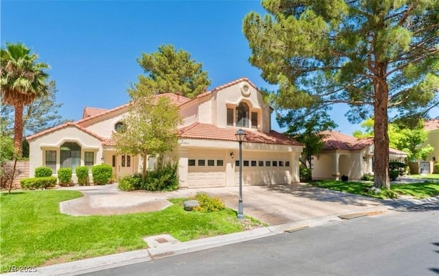 mediterranean / spanish-style home with a front lawn, a tile roof, stucco siding, a garage, and driveway