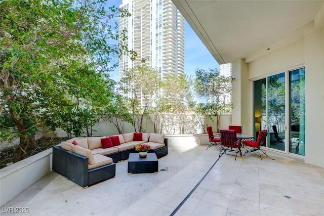 view of patio / terrace with an outdoor hangout area and fence