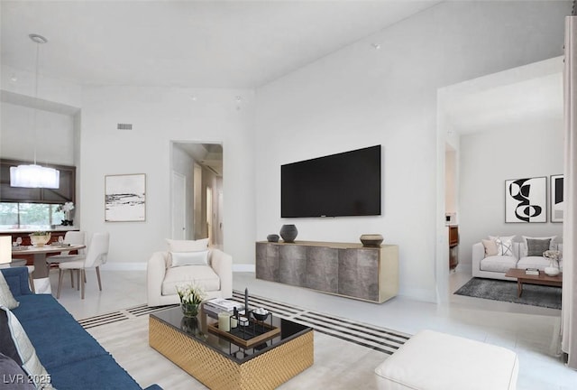 living room featuring baseboards and visible vents