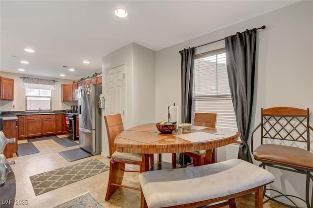 dining room featuring recessed lighting and light floors