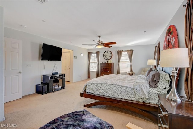 bedroom with light colored carpet and ceiling fan