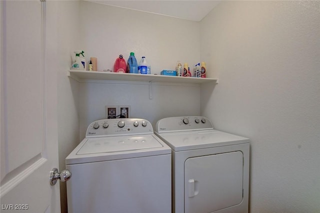 laundry room with separate washer and dryer and laundry area