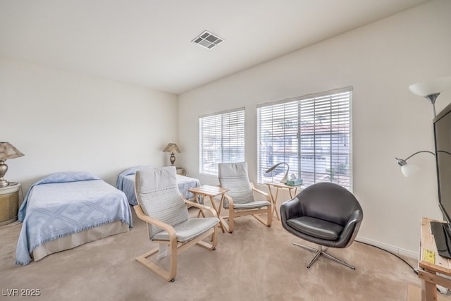 bedroom with visible vents and carpet