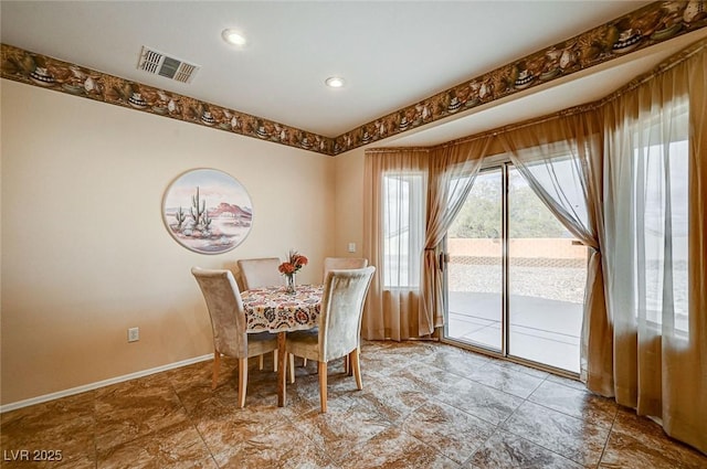 dining room with visible vents and baseboards