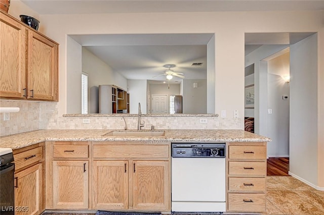 kitchen with dishwasher, ceiling fan, tasteful backsplash, and a sink