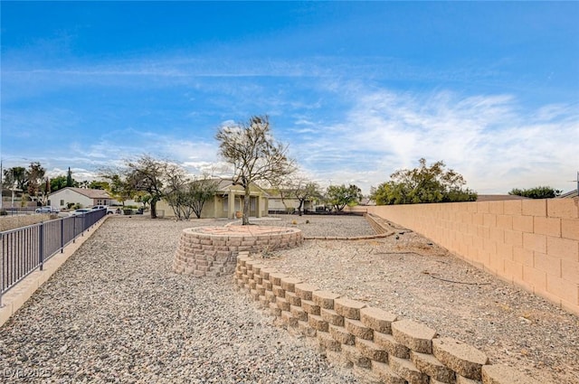 view of yard with a fenced backyard