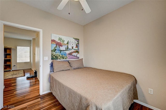 bedroom with wood finished floors, baseboards, and ceiling fan