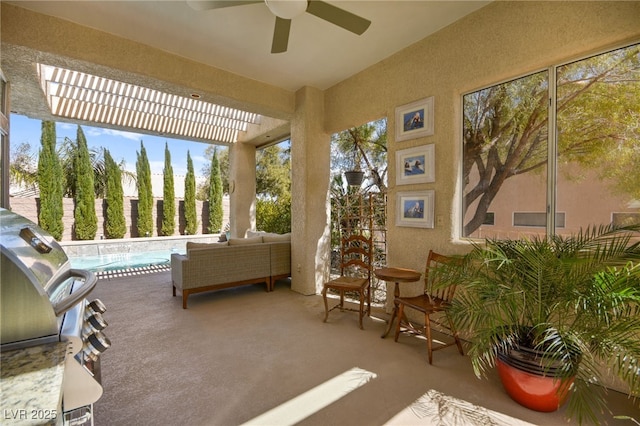 sunroom with a ceiling fan