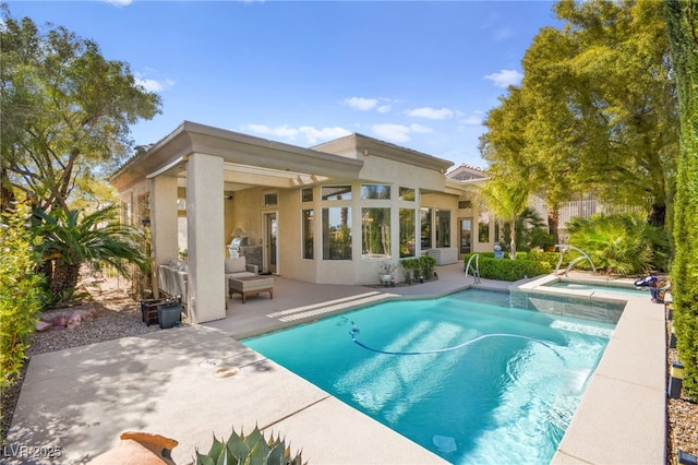 pool featuring a patio area