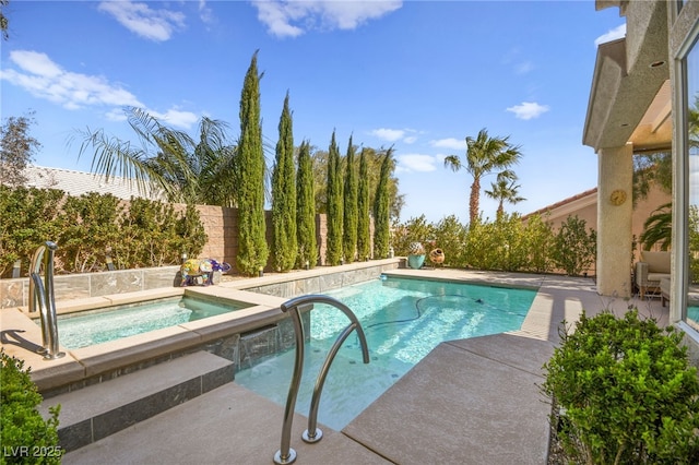 view of pool featuring an in ground hot tub, a patio area, a fenced in pool, and a fenced backyard