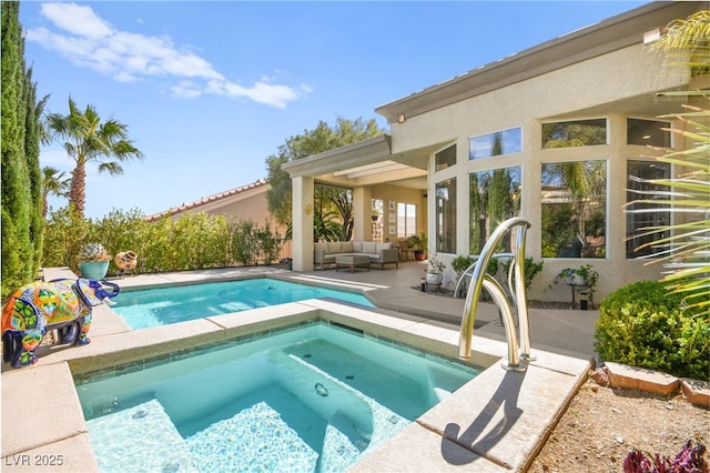 view of swimming pool with an in ground hot tub, an outdoor hangout area, and a patio