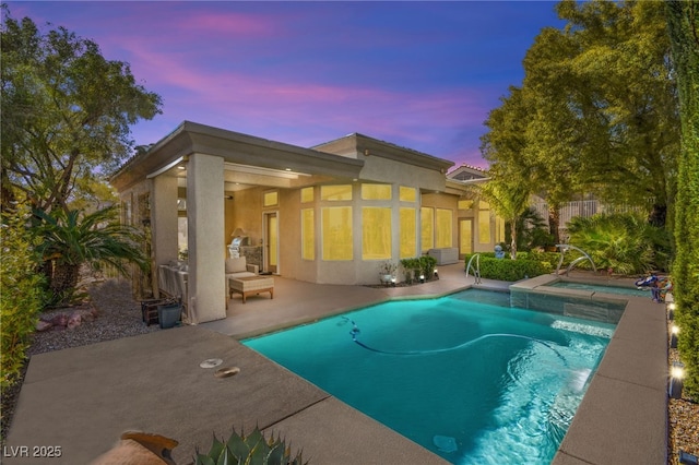 outdoor pool featuring a patio area