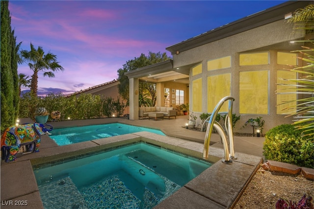 view of swimming pool with a patio area, an in ground hot tub, and an outdoor hangout area