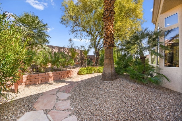 view of yard with a patio and fence