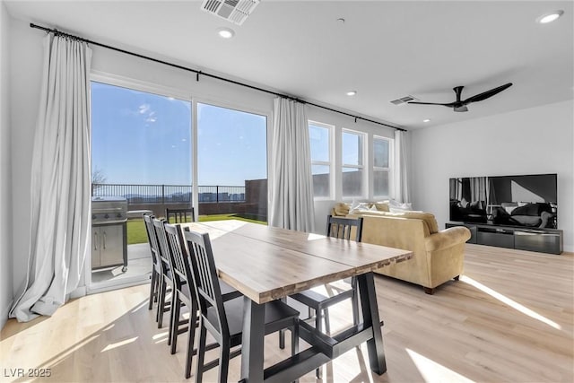 dining space featuring recessed lighting, visible vents, and light wood-type flooring