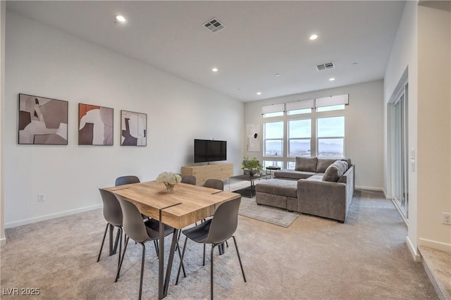 dining area featuring recessed lighting, visible vents, light colored carpet, and baseboards