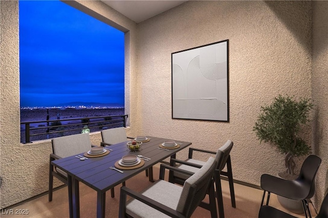 dining area with a textured wall