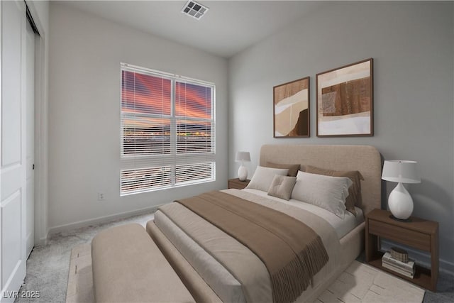 bedroom featuring baseboards, visible vents, and carpet floors