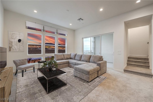 living room featuring stairway, carpet flooring, recessed lighting, and visible vents