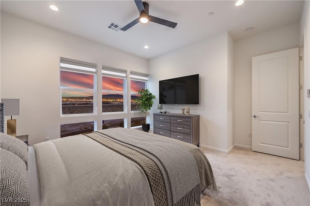 bedroom featuring visible vents, a ceiling fan, recessed lighting, baseboards, and light colored carpet