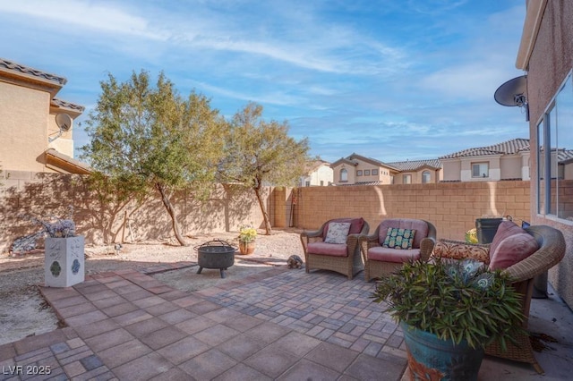view of patio / terrace featuring a fire pit and a fenced backyard