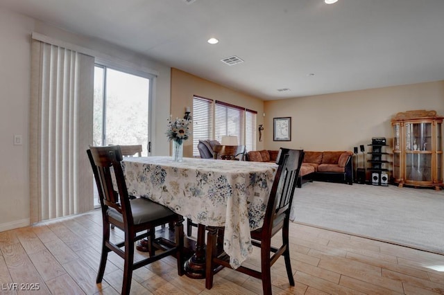 dining room with recessed lighting, visible vents, and light wood finished floors