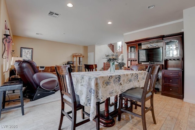dining space with visible vents, baseboards, ornamental molding, recessed lighting, and light wood-style floors