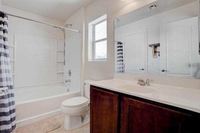 bathroom with vanity, visible vents, shower / bath combo with shower curtain, tile patterned floors, and toilet
