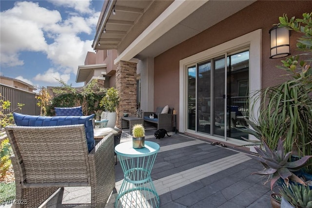 wooden deck featuring fence and an outdoor hangout area