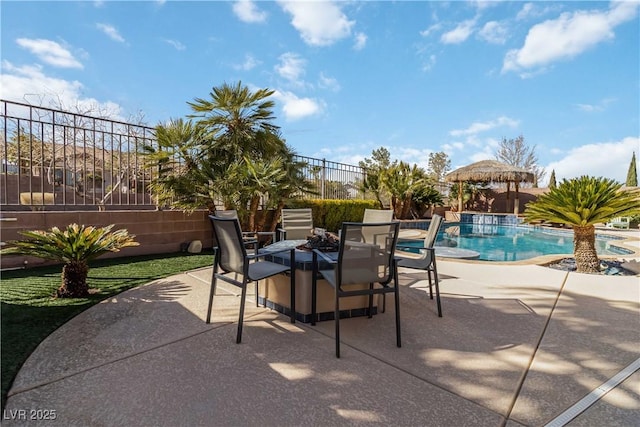 view of patio featuring a fenced in pool and fence