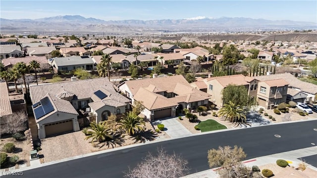 drone / aerial view featuring a mountain view and a residential view