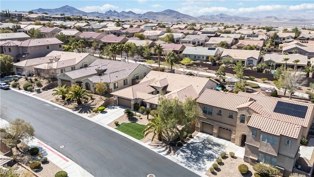 aerial view featuring a mountain view and a residential view