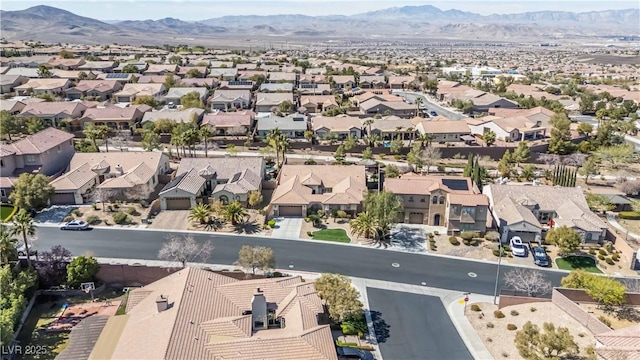 birds eye view of property featuring a mountain view and a residential view