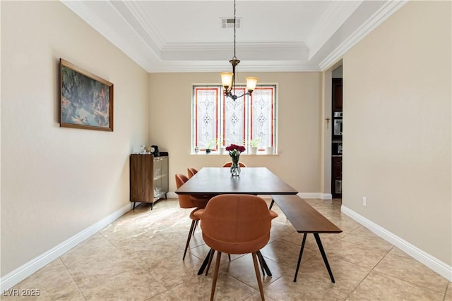 dining space with a raised ceiling, crown molding, visible vents, and baseboards