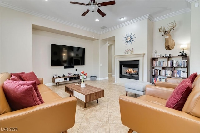 living area featuring light tile patterned floors, a lit fireplace, and ornamental molding